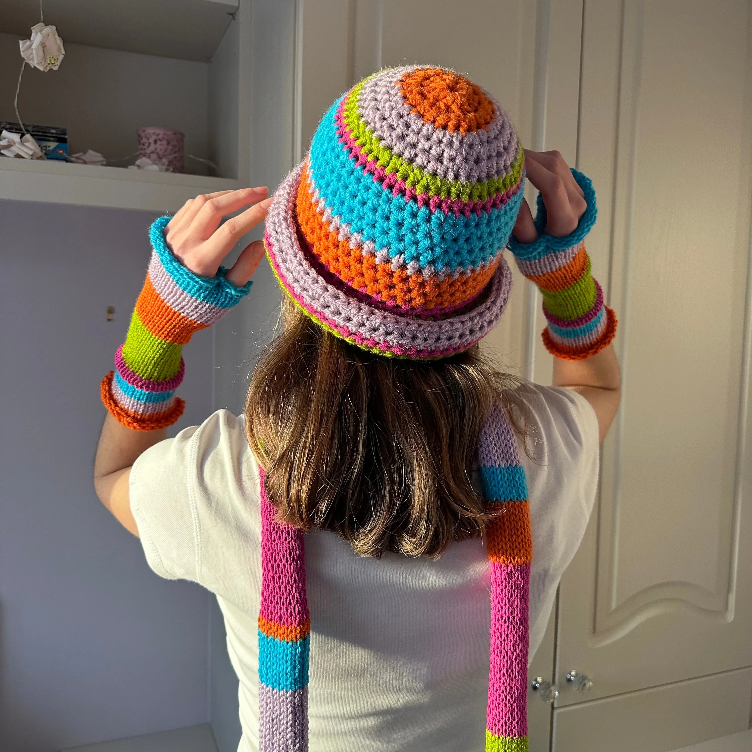 Handmade knitted rainbow striped hand warmers