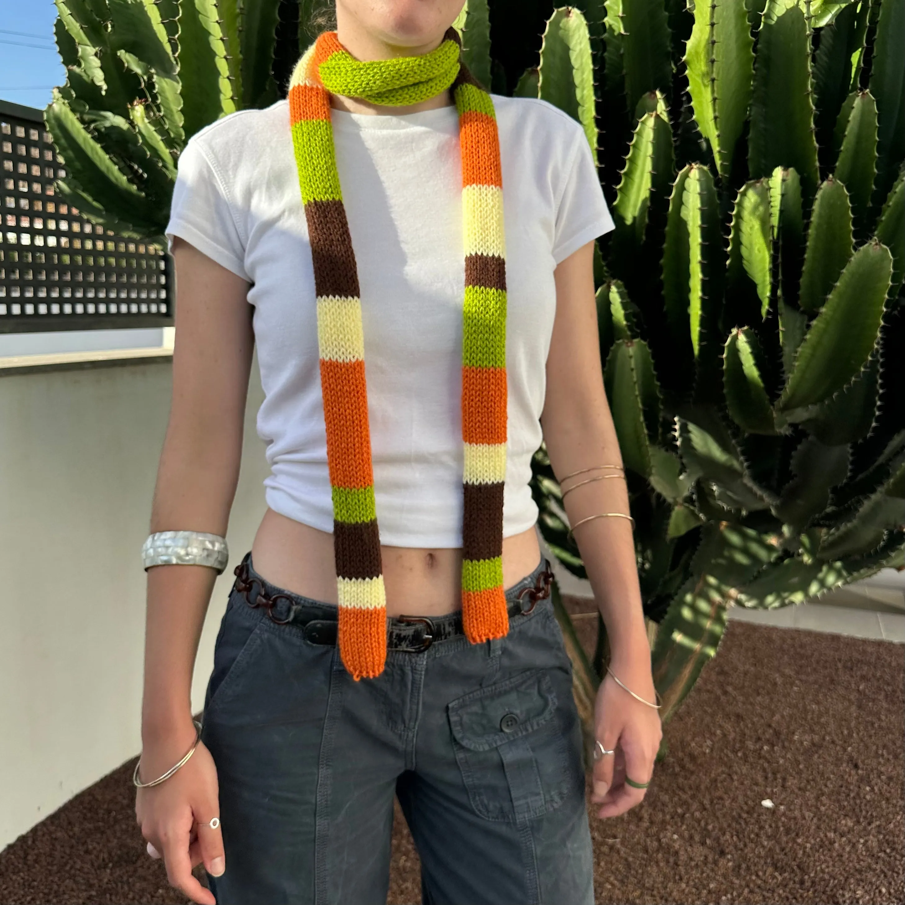 The Linea Scarf - handmade knitted stripy skinny scarf in orange, brown green and yellow