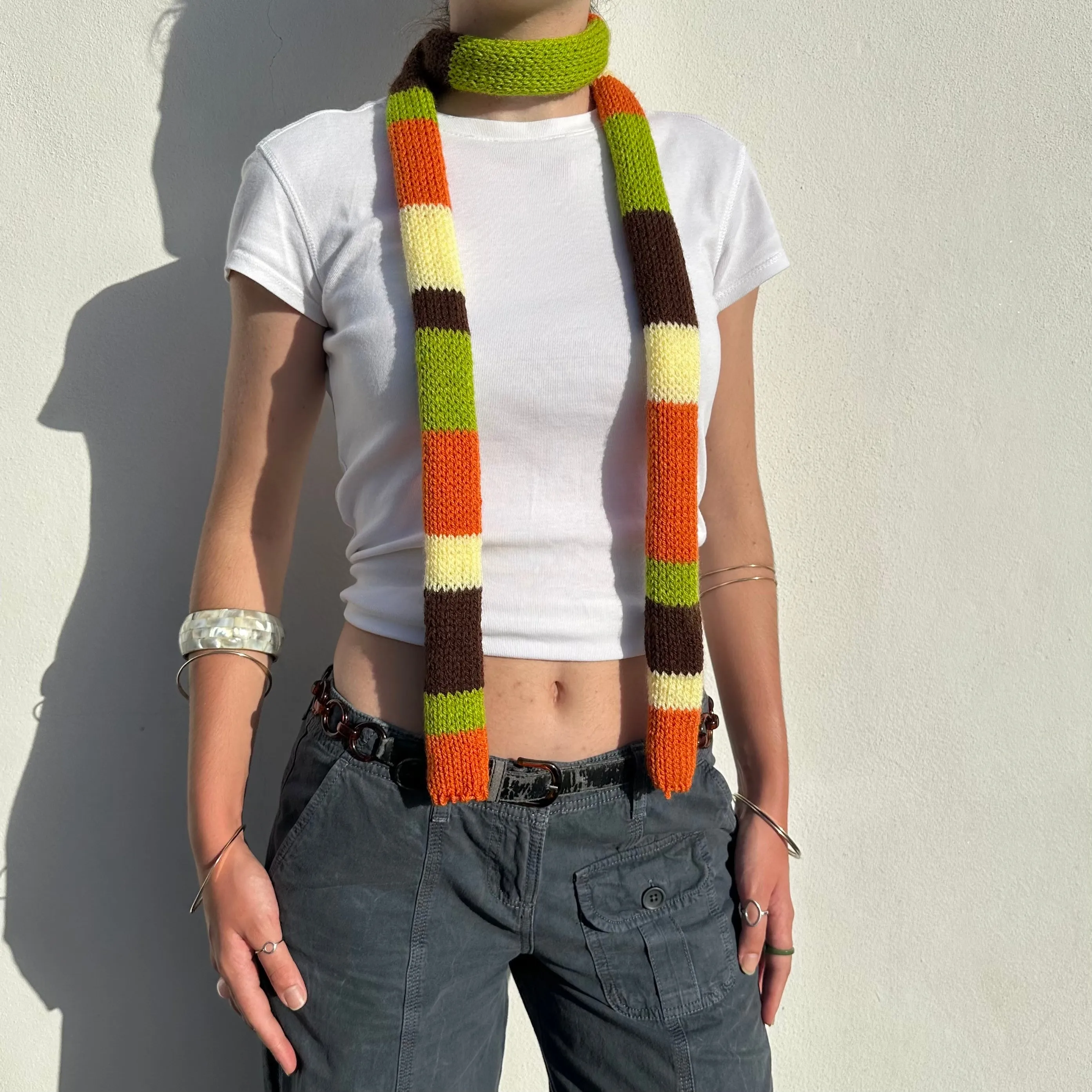 The Linea Scarf - handmade knitted stripy skinny scarf in orange, brown green and yellow