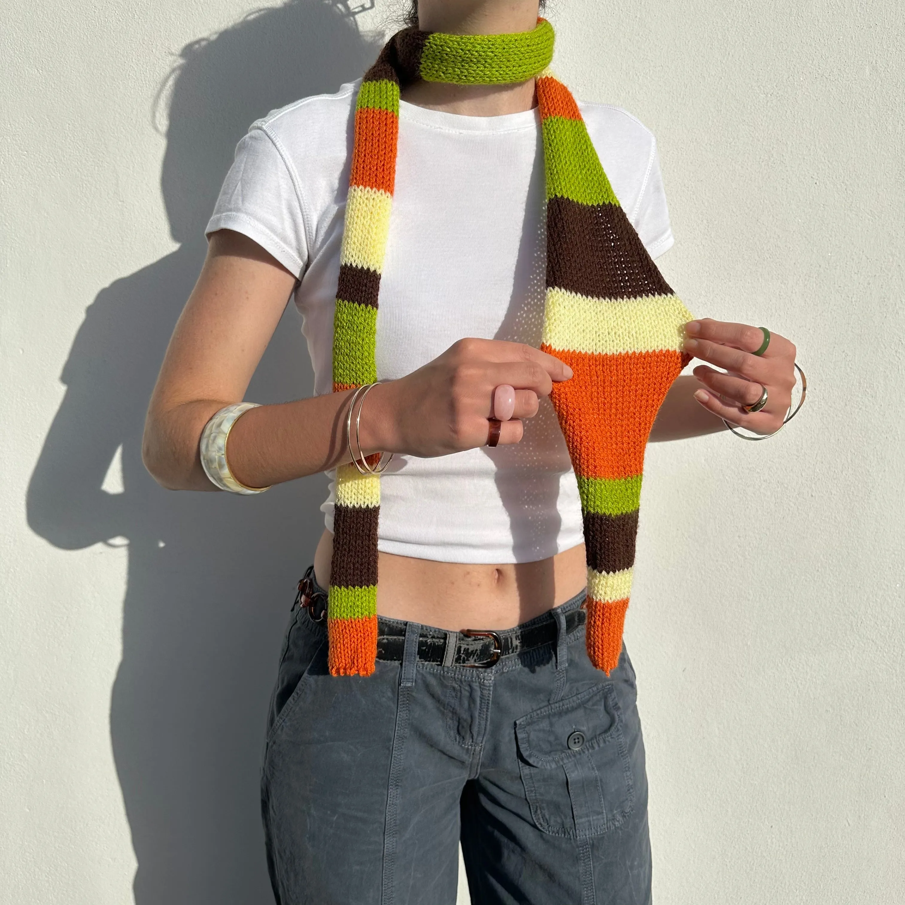 The Linea Scarf - handmade knitted stripy skinny scarf in orange, brown green and yellow